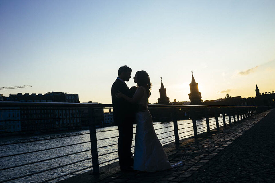 Couple silhouetted by River Spree