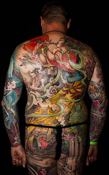 Tattooed man with a full-body oriental style tattoo – Portraiture