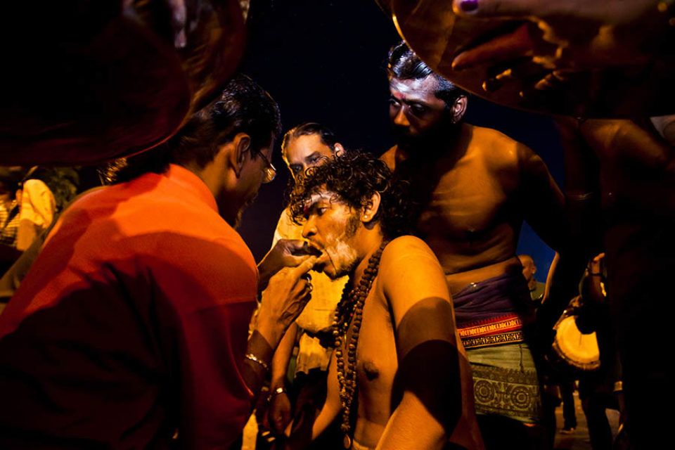 Celebrant having cheek pierced