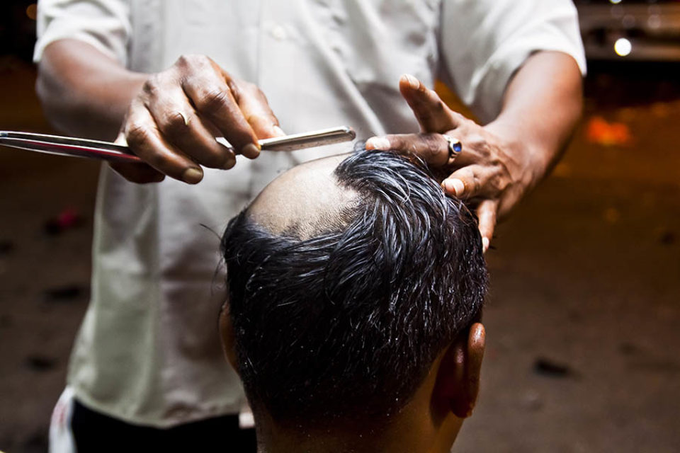 Devotee has his head shaved