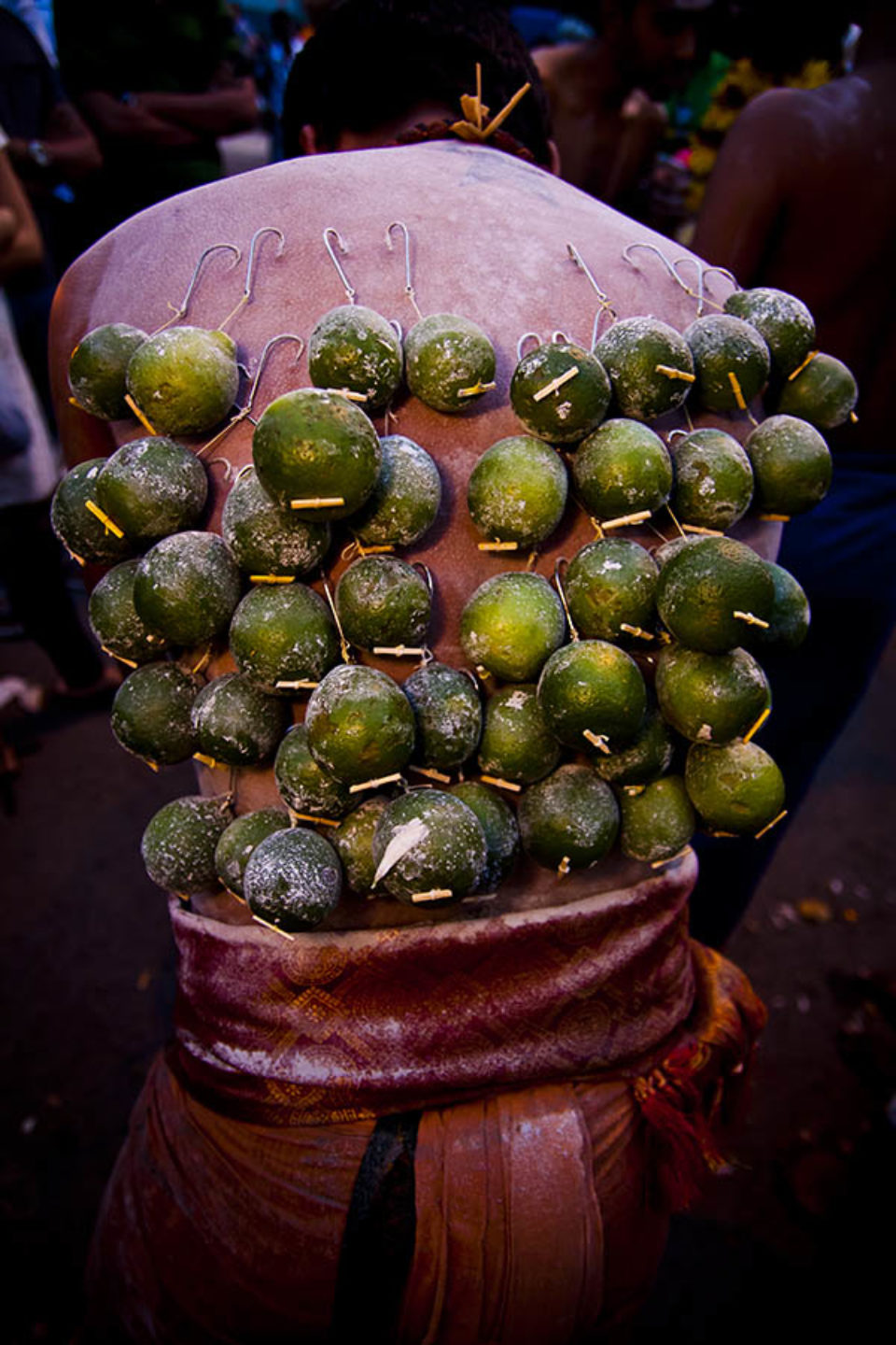 Fruit kavadis hooked into celebrant's back
