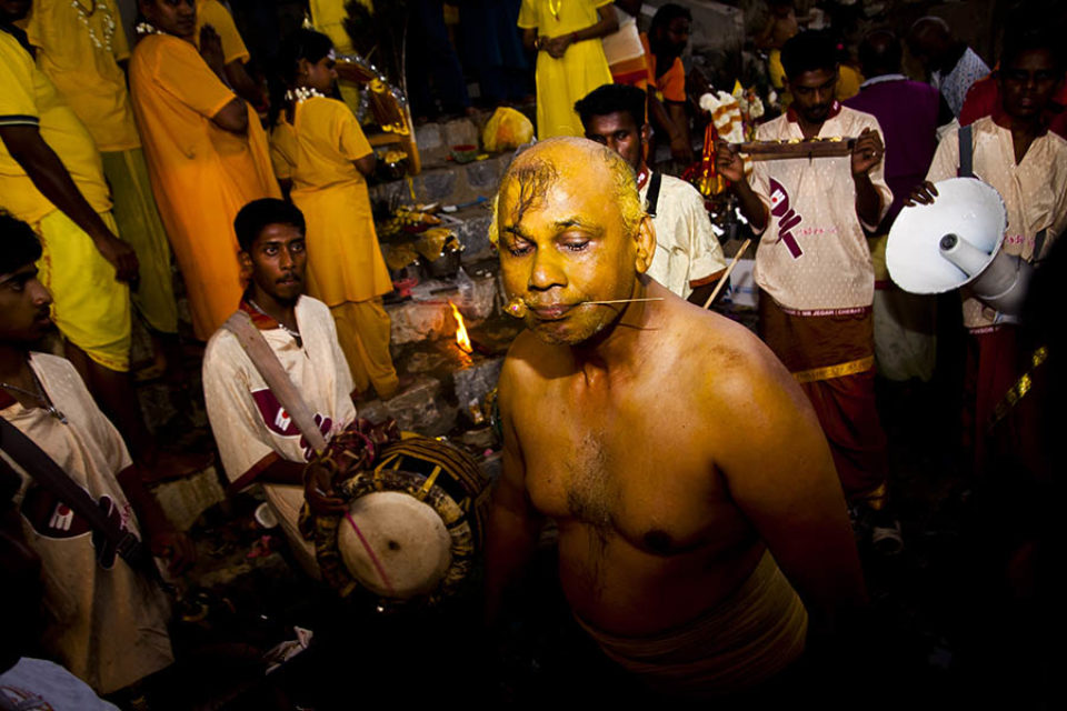 Entranced celebrant with pierced cheek