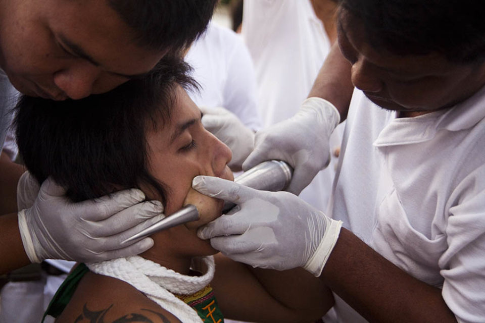 Ma-song being pierced