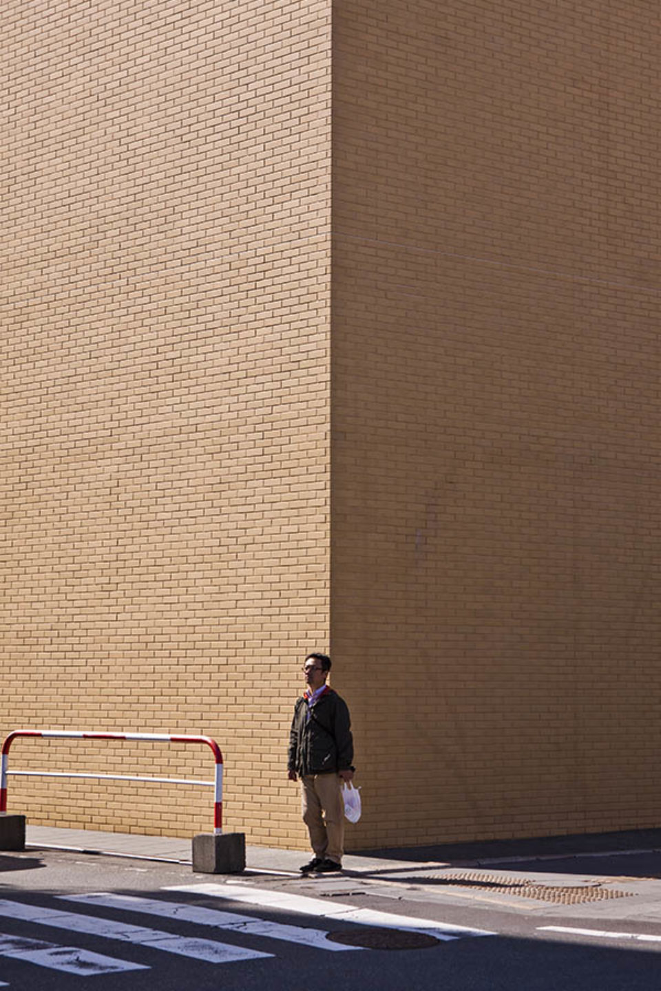 Man waiting to cross road, Nagano