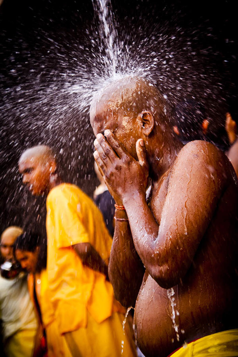 Celebrant takes a purifying shower