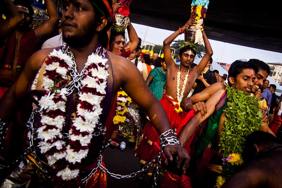 Entranced celebrants waiting with kavadis for procession
