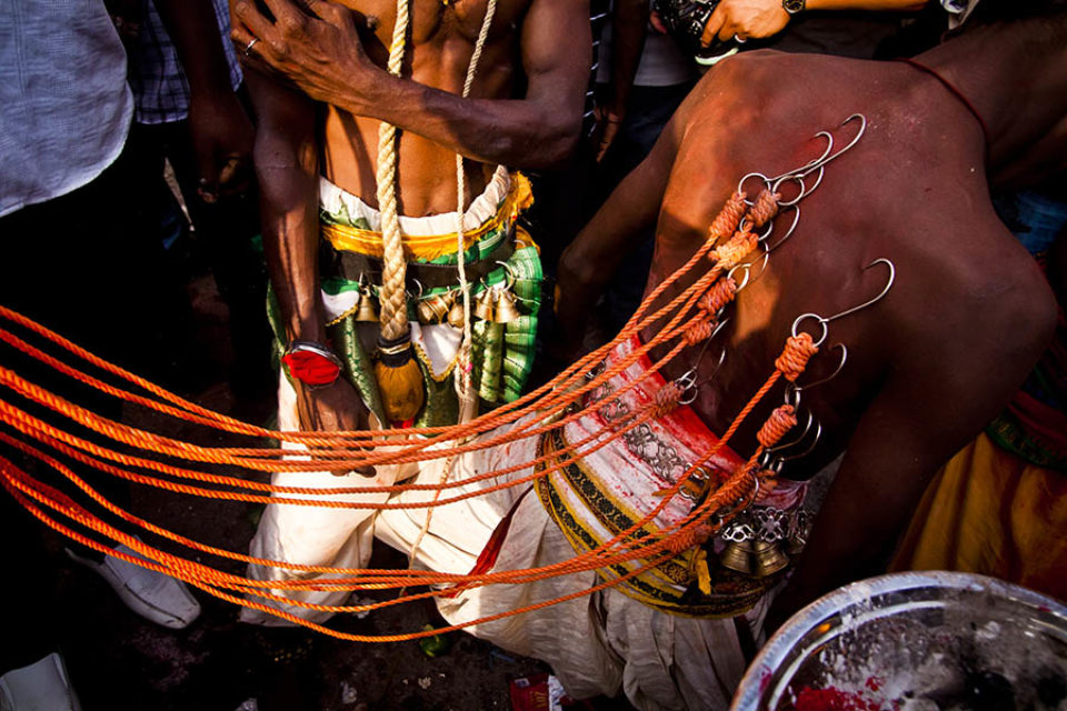 Kavadi hooked into celebrant's back
