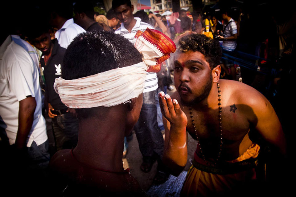 Celebrant blesses kavadi bearer