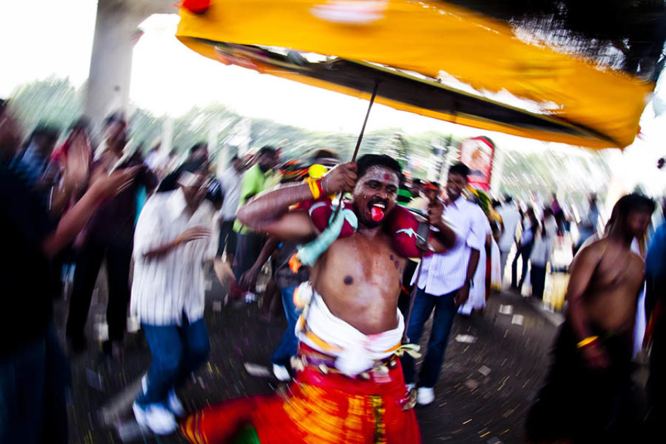 Dancing kavadi bearer during procession