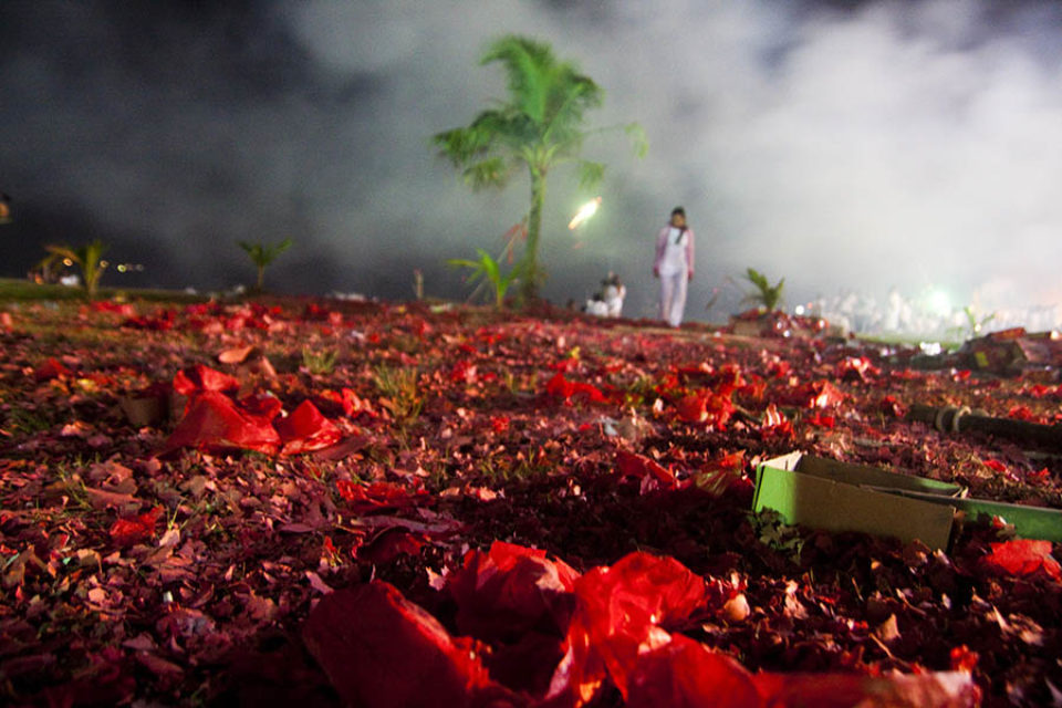 Firecracker debris and smoke at festival's end