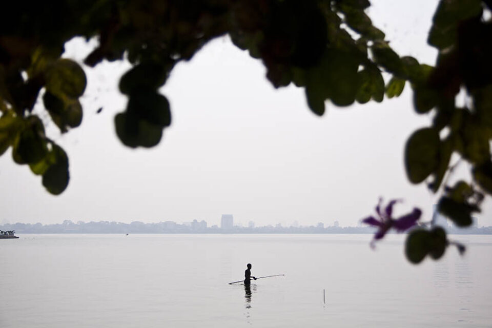 Fisherman in West Lake, Hanoi, Vietnam