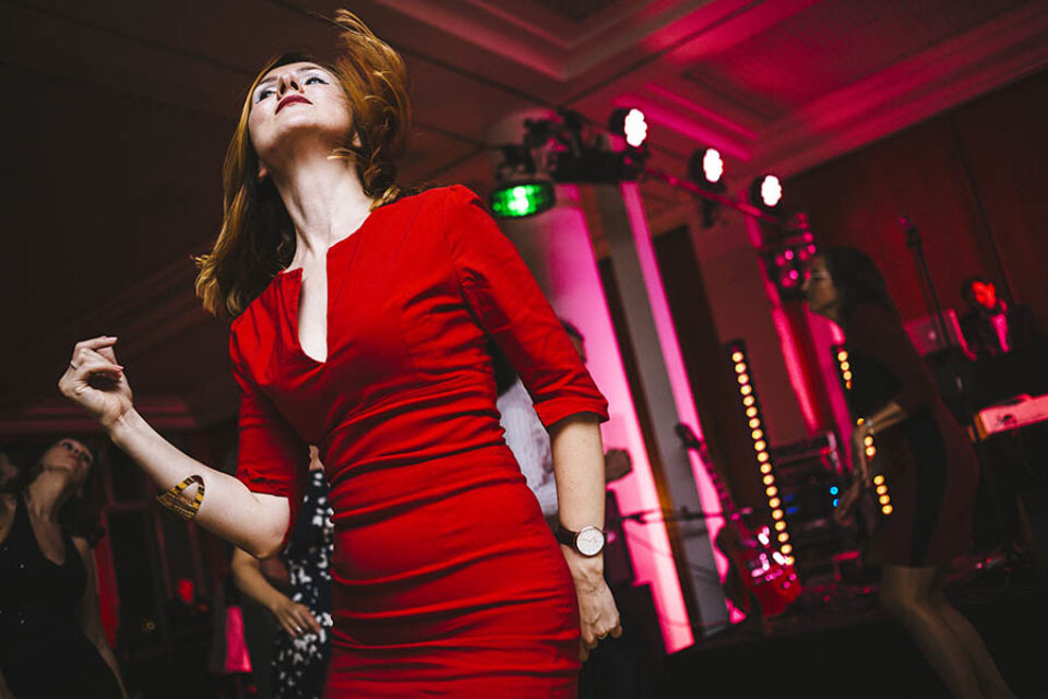 A woman dances at a party, image by Montreal event photographer