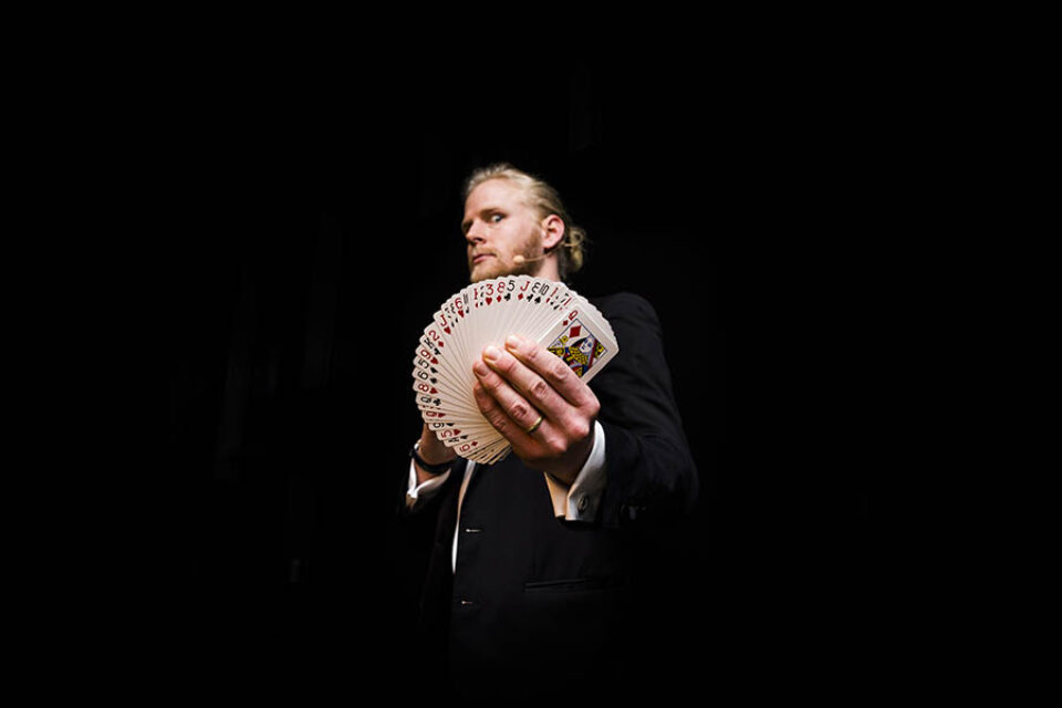 A magician doing a card trick