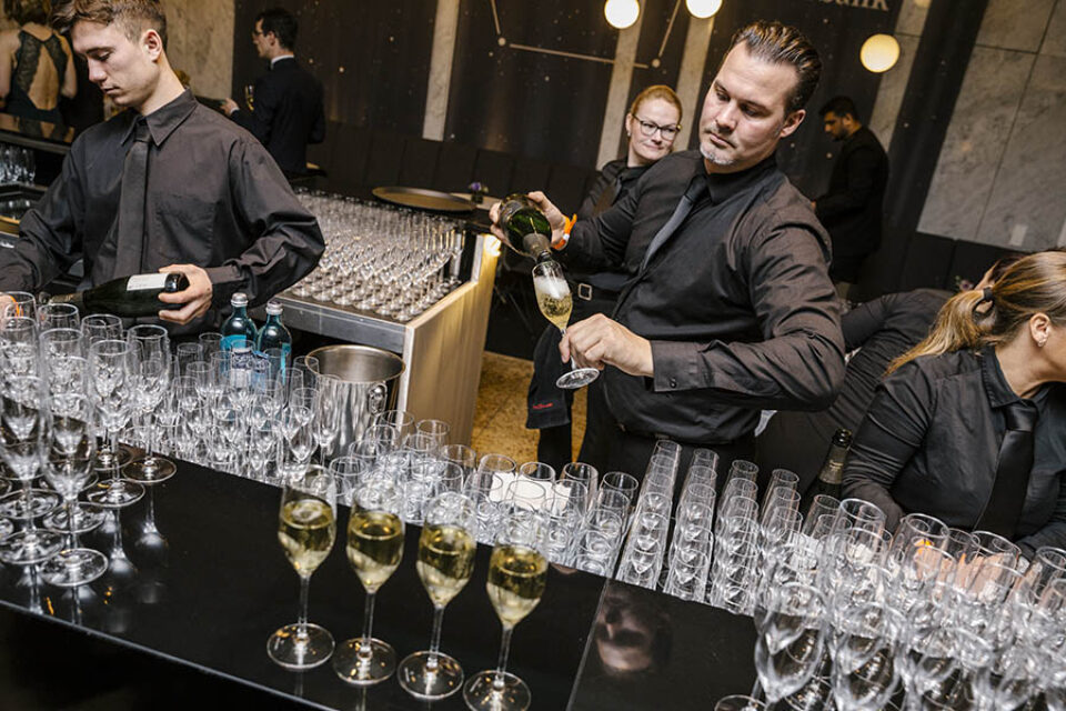 Barman pouring champagne