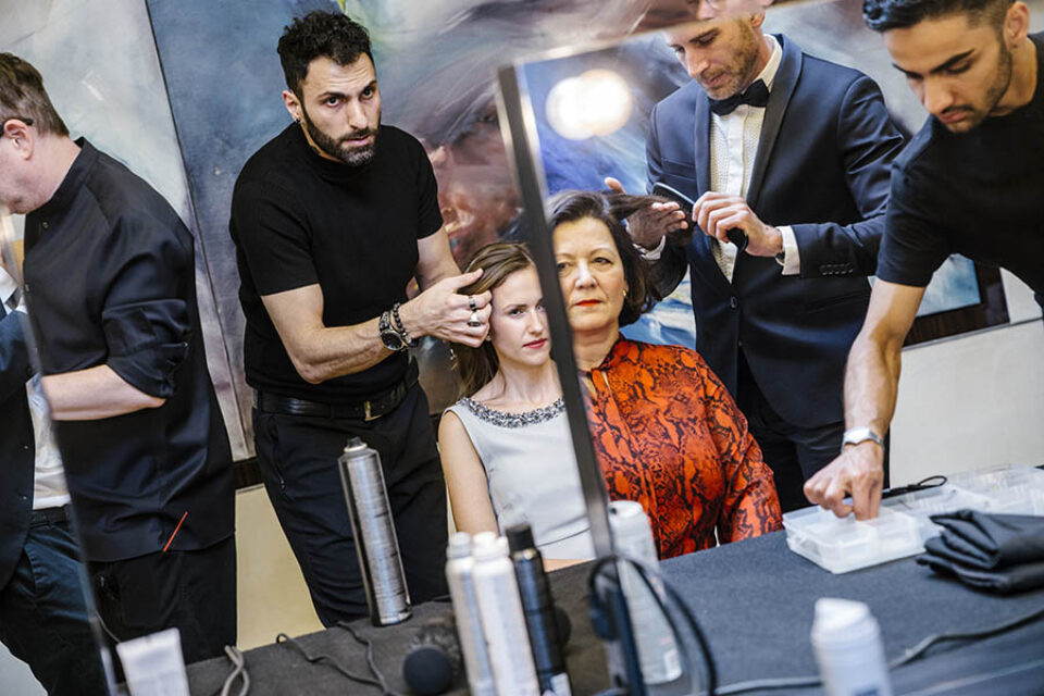Woman hairstyled in mirror