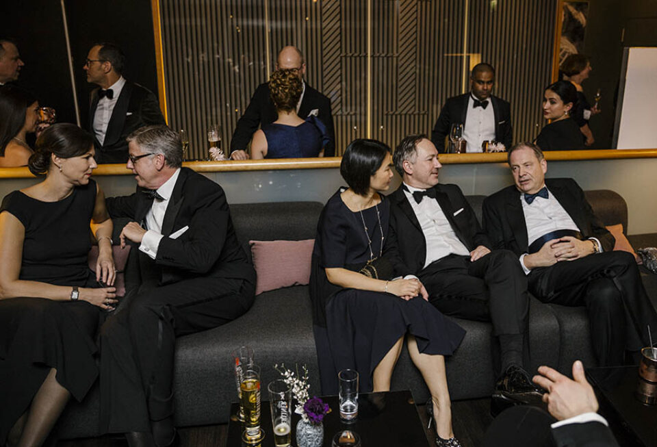 People relax at formal event