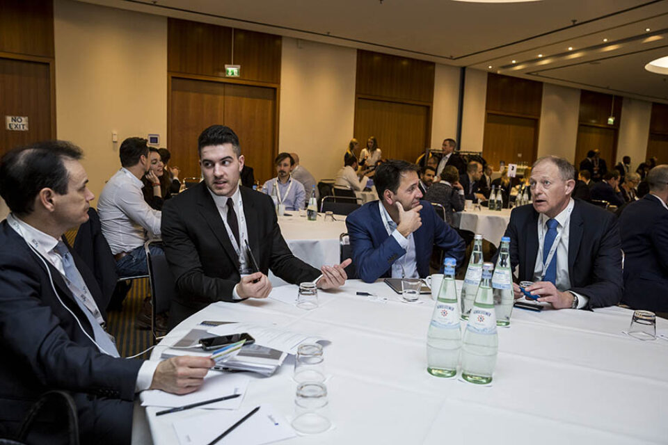 Delegates chat during event