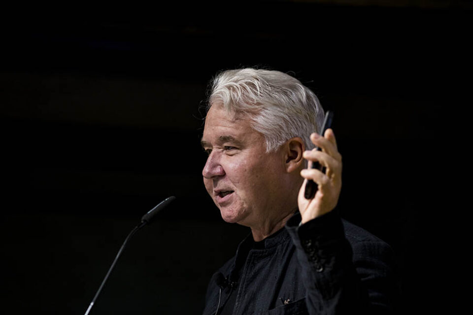 Presenter holding smartphone
