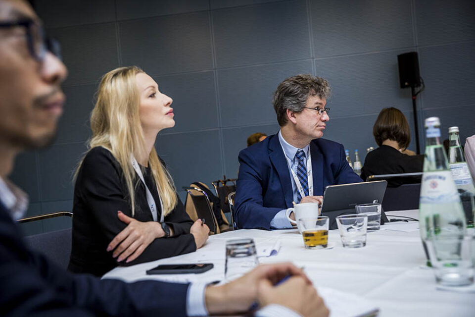 Event attendees concentrating on a presentation