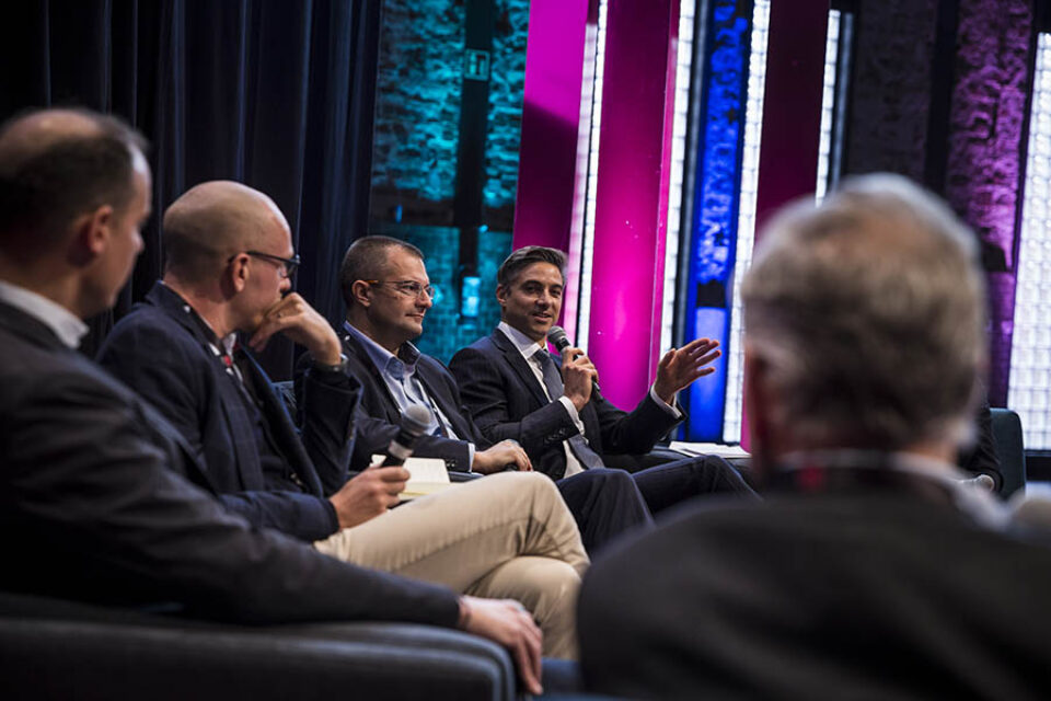 Event panelist talking onstage