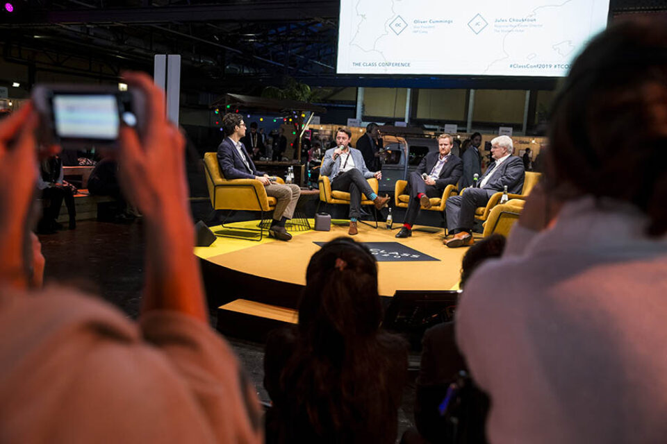 Event delegates watch panel discussion