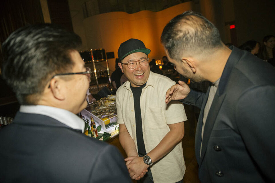 Corporate event guests laughing at a networking event in Montreal