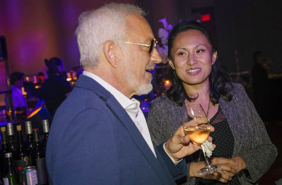 Man and woman with drink at Montreal corporate event
