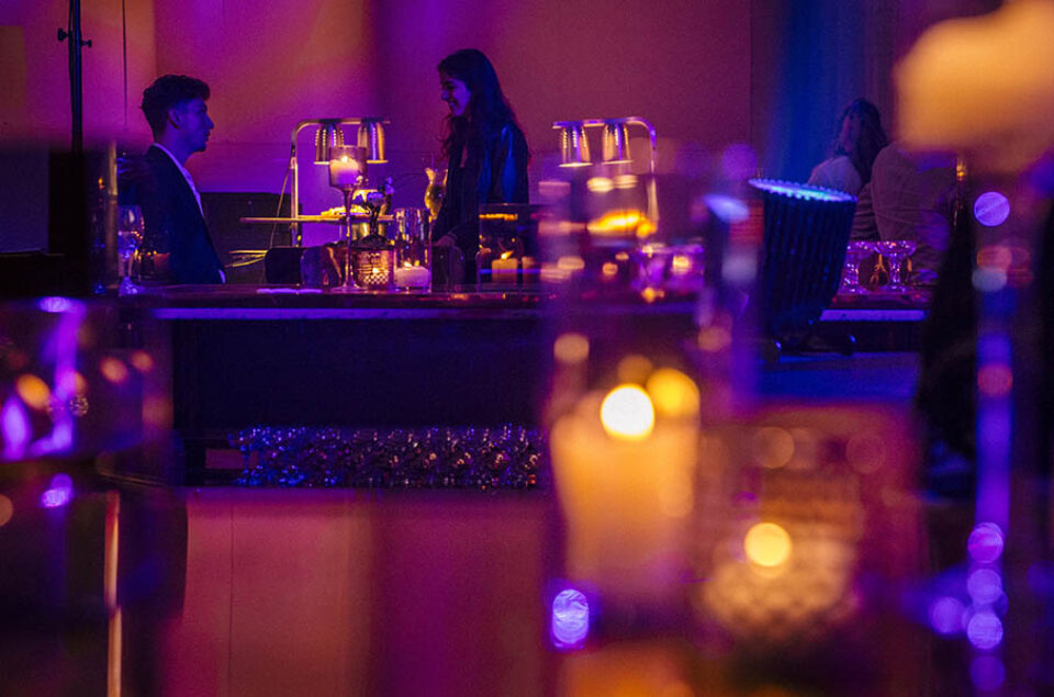 Couple seen through candlelight at a Montreal corporate event