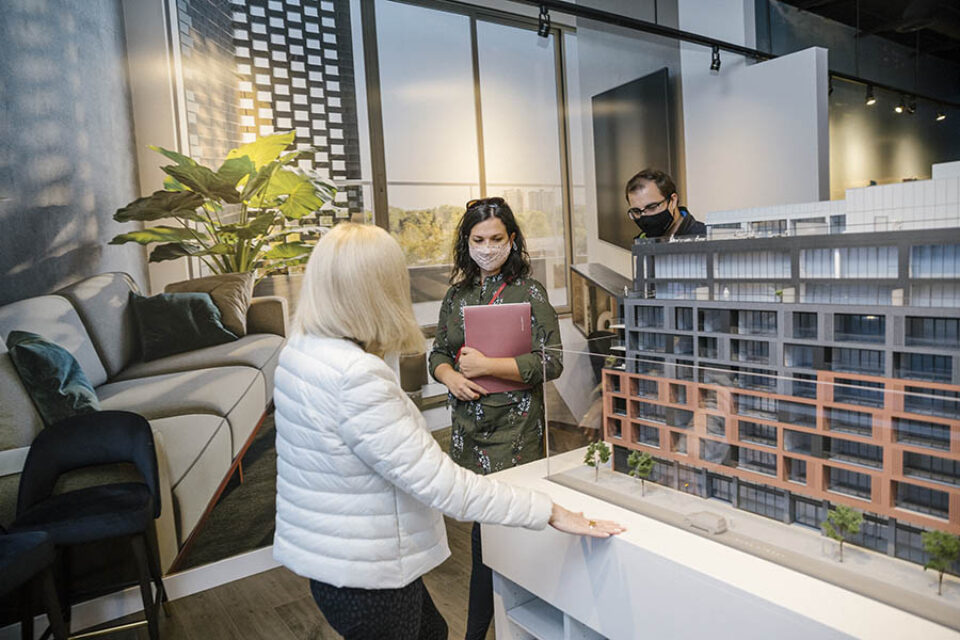 Clients look at scale model, Ottawa event photography