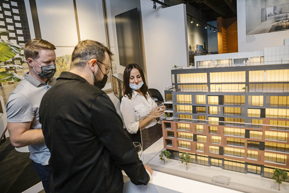 Clients inspecting scale model, Ottawa event photography