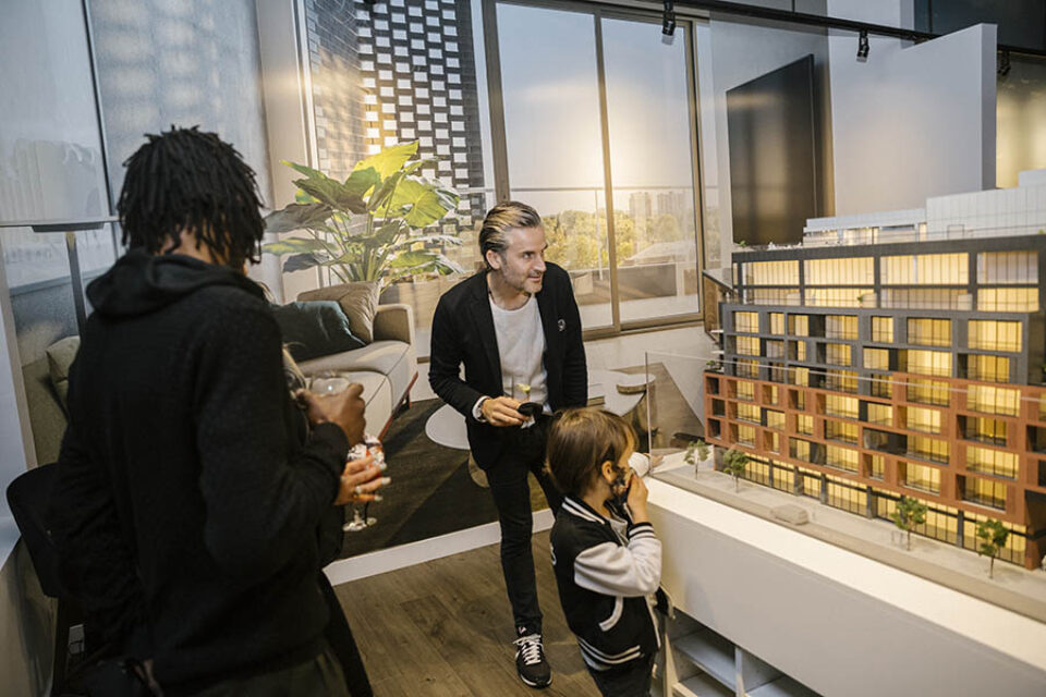 People look at condo scale model at an event in Ottawa