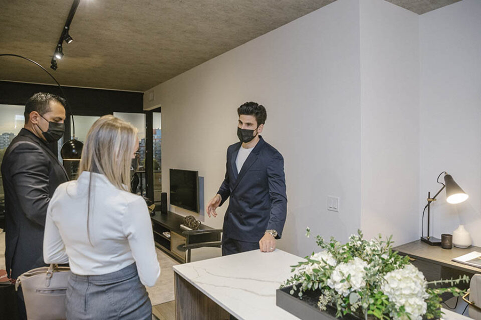 Broker showing residence details at an event in Ottawa