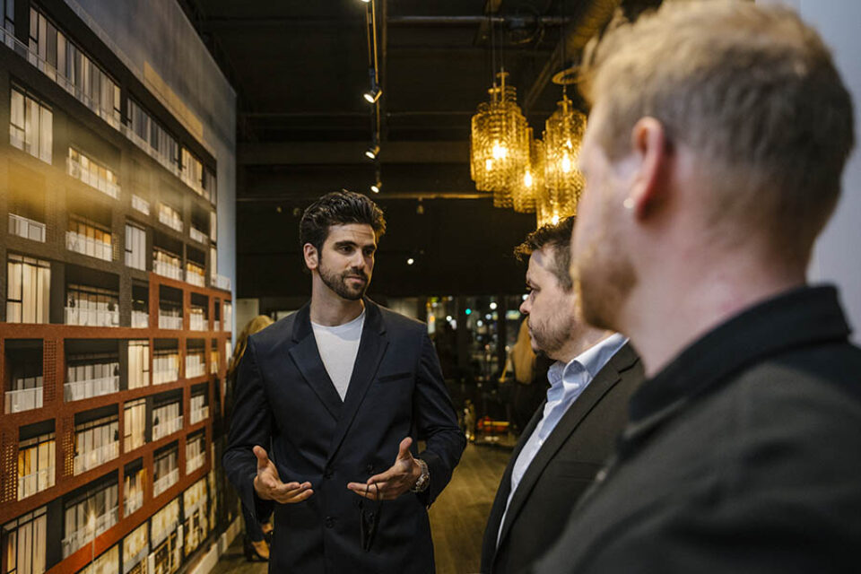 Broker in Ottawa chats with prospective clients at a real estate event