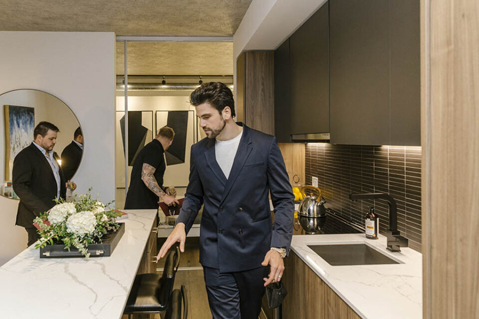 Showing clients around model residence, Ottawa real estate event photography