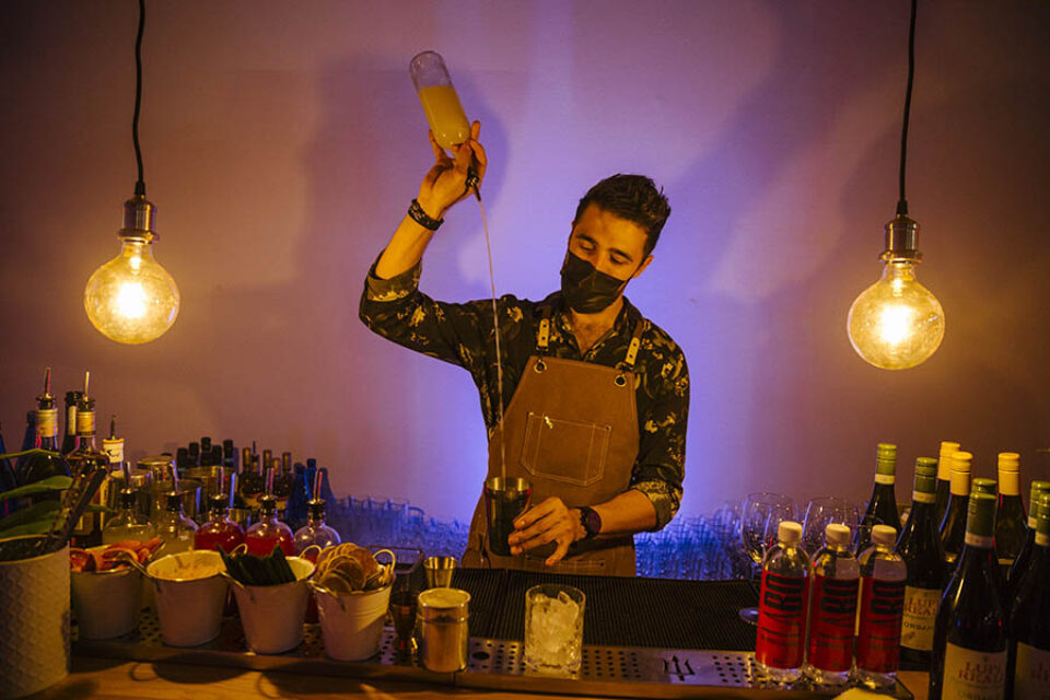 Barman mixing a cocktail at a corporate event in Montreal