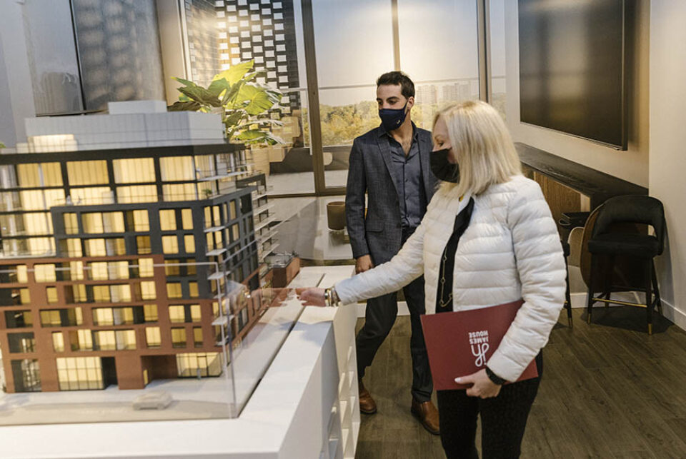 Client being shown scale model at an Ottawa event