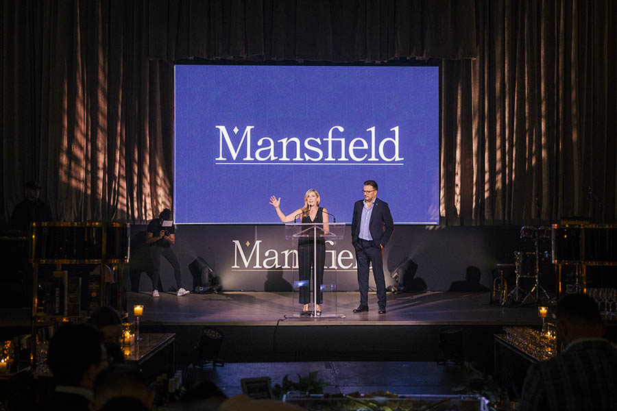 Real estate event photographer -Corporate event presenters onstage