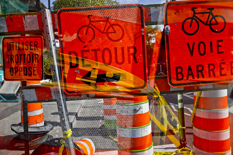 Orange signs and construction cones at a construction site in Montreal, Quebec, Canada