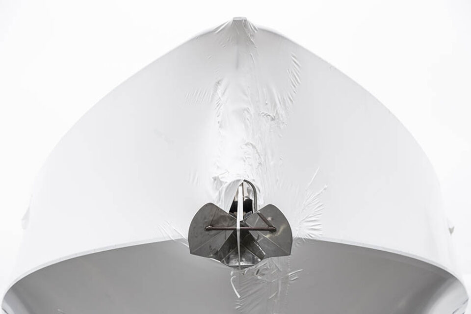 Boat propeller visible outside wrapping