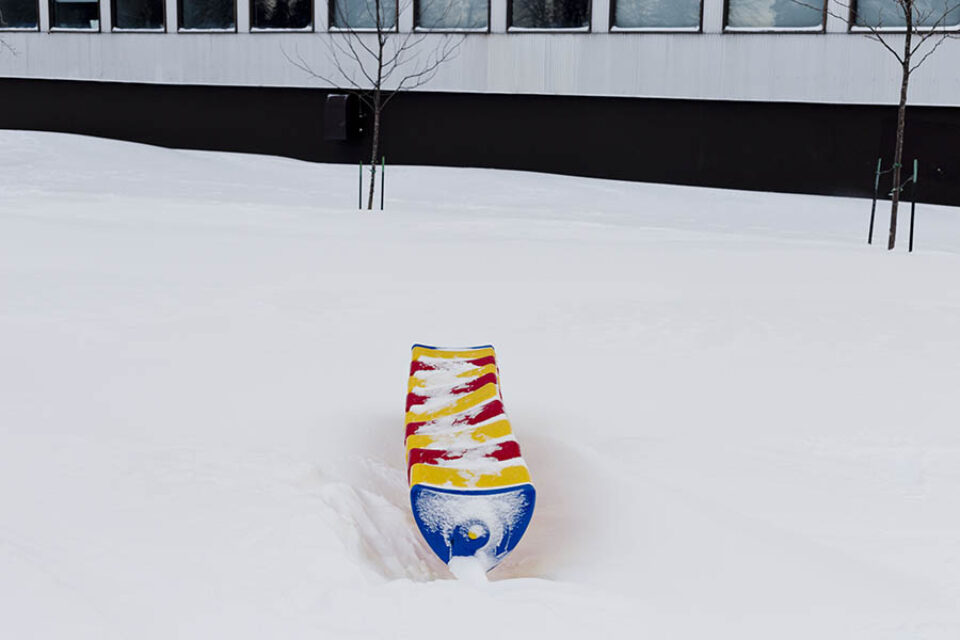 Snow-covered play structure