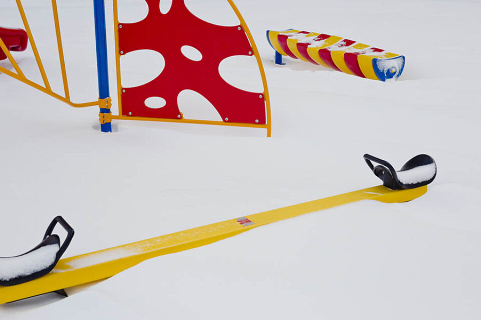 Snow-covered see-saw
