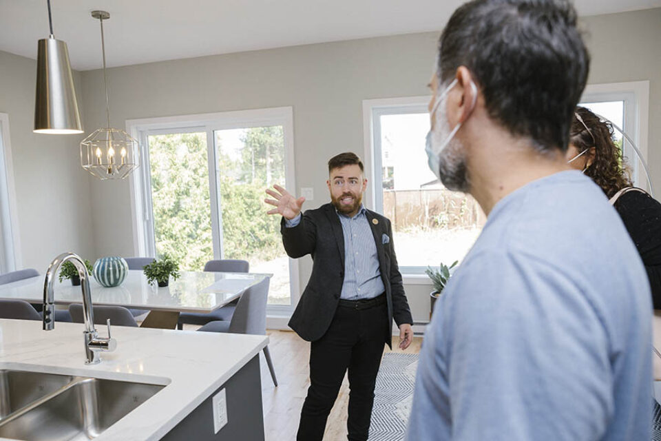 Real estate broker demonstrating model home