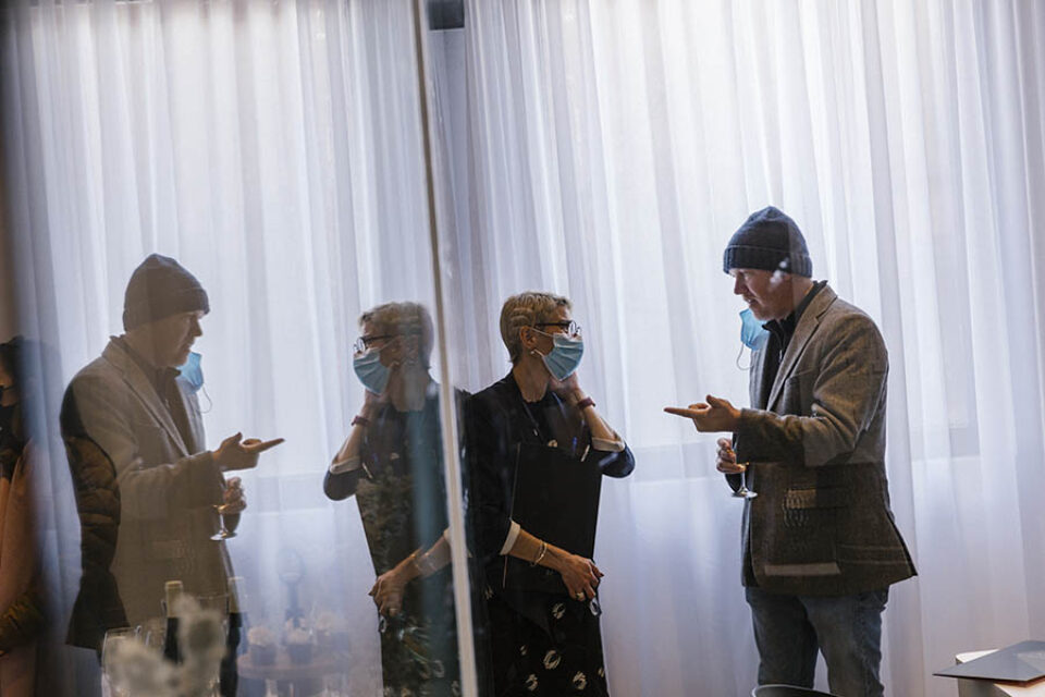 Refection of real estate brokers chatting