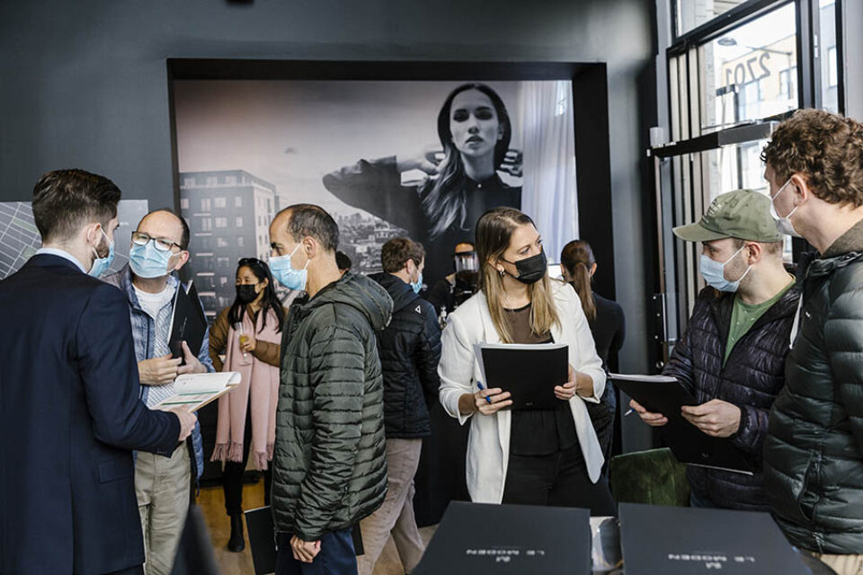 Real estate brokers and clients mingle at event