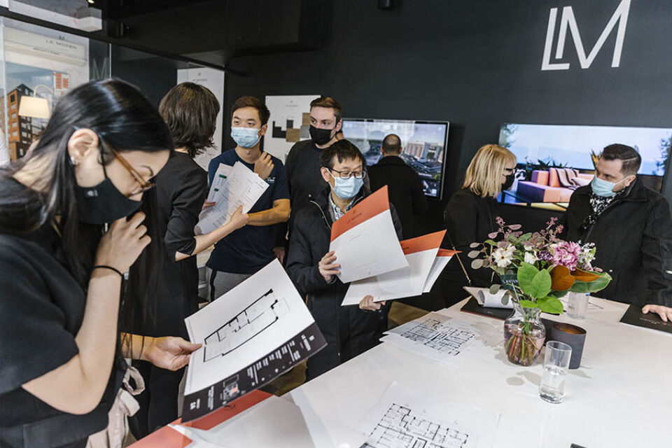Potential buyers look at real estate floor plans