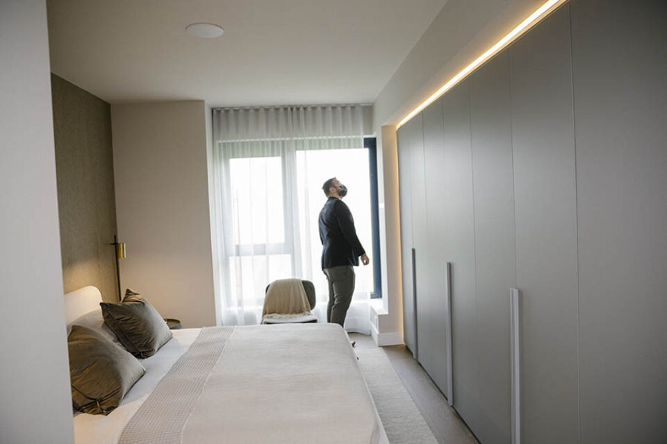 Real estate broker inspects model residence