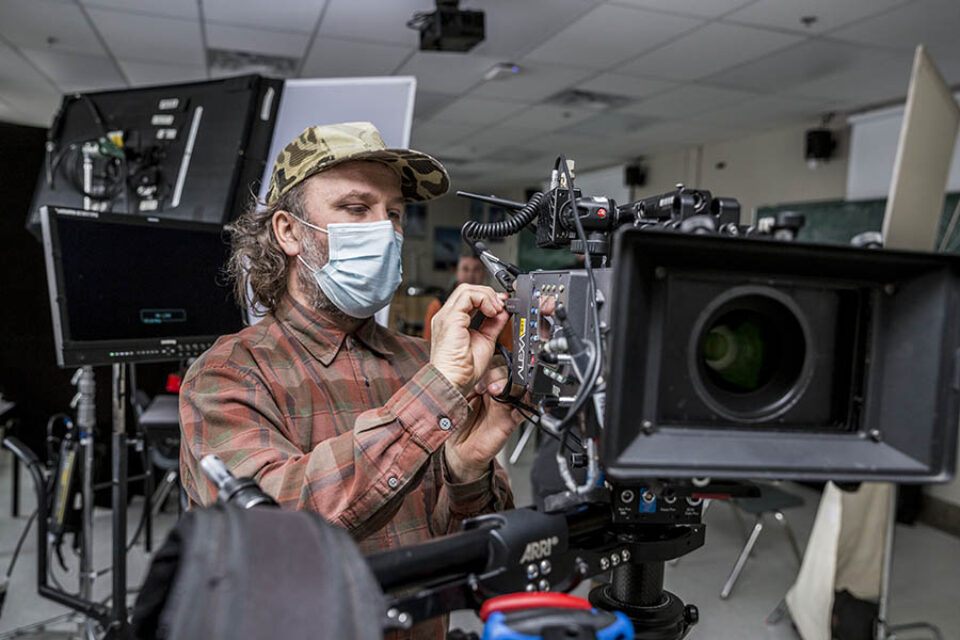 Camera operator checks camera
