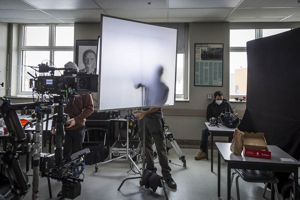 Preparing lighting equipment on film set