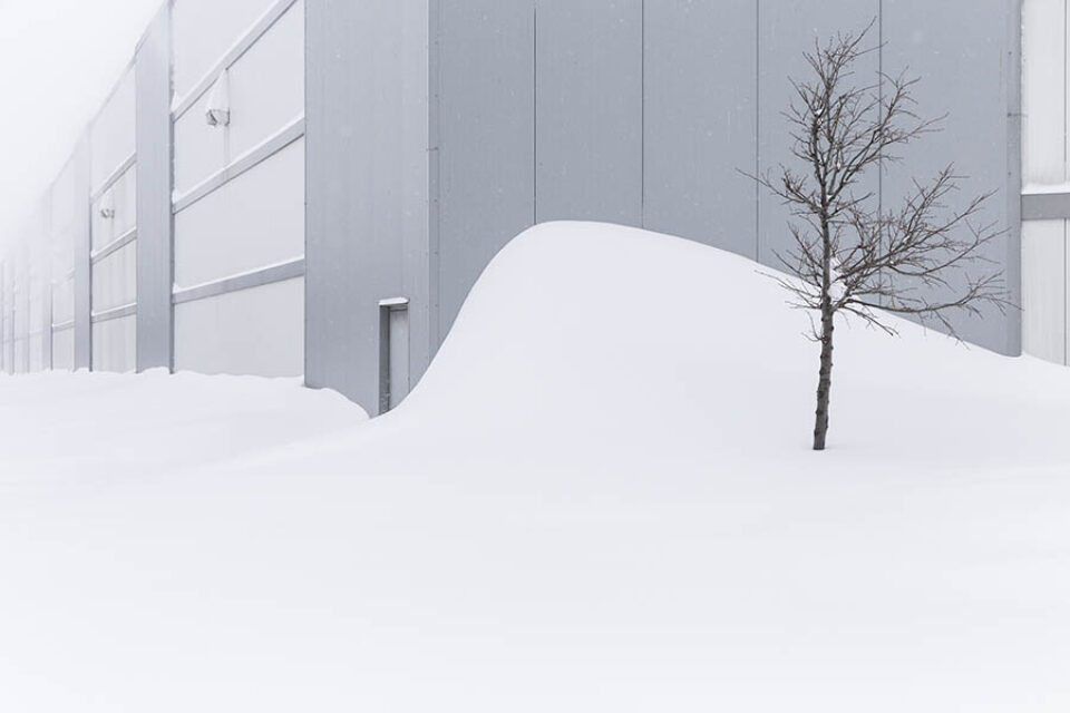 Snowdrift against industrial building