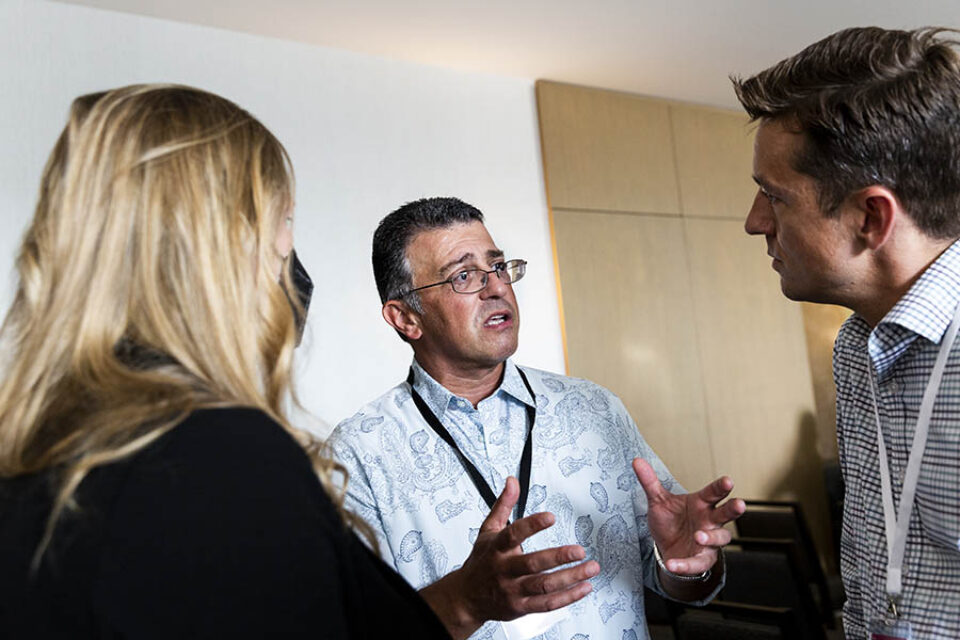 Delegates converse during a corporate event in Montreal